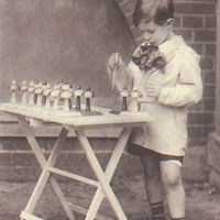 Campanelli A boy placing the bells in the right order. Postcard published by the DMG (German Montessori Society), around 1927 - T. Müller, R. Schneider, <em>Lehrmaterialien 1913-1935. Möbel und Architektur. Techning Meterials 1913-1935. Furniture and Architecture</em>, München, Prestel Verlag, 2002, p.95$$$459